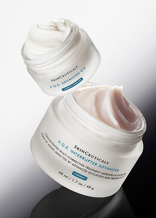 Skincare products with droppers and mixing tools.